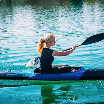woman on a lake kayaking